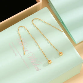 Gold threader earrings on a light green card with 'Happy Birthday' text.